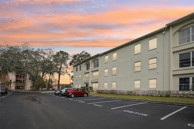 view of parking at dusk