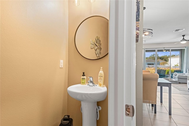 bathroom featuring tile patterned flooring, ceiling fan, and sink