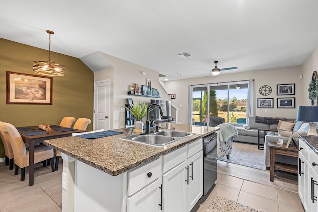 kitchen featuring sink, hanging light fixtures, an island with sink, light tile patterned flooring, and white cabinetry