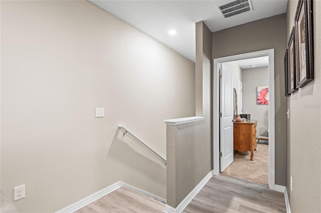 hall with light wood-type flooring