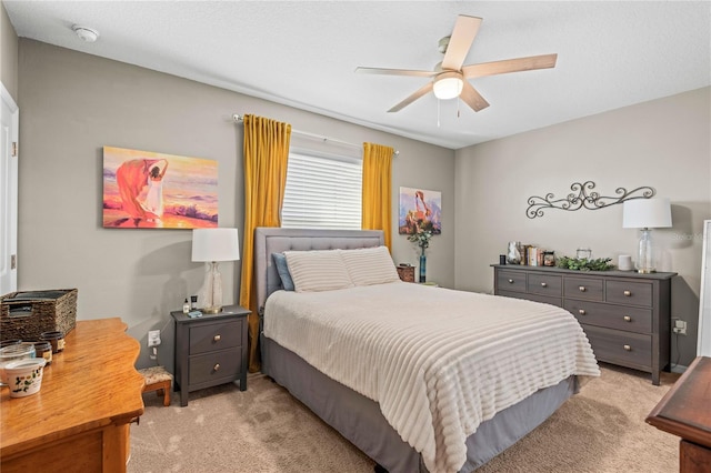 bedroom featuring ceiling fan and light colored carpet