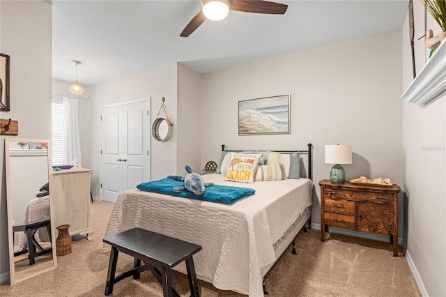 carpeted bedroom featuring ceiling fan