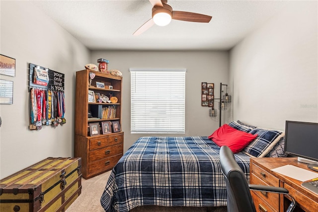 bedroom with light carpet and ceiling fan