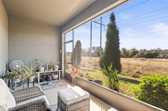 sunroom / solarium featuring a rural view