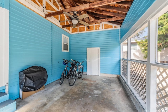 exterior space featuring ceiling fan and vaulted ceiling