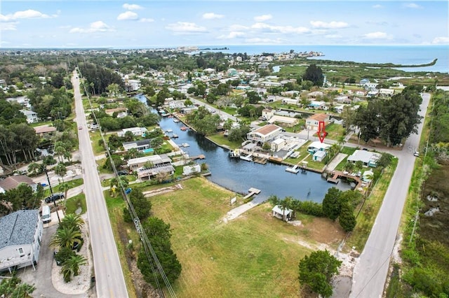 birds eye view of property featuring a water view