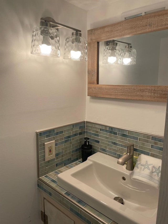 bathroom with decorative backsplash and sink