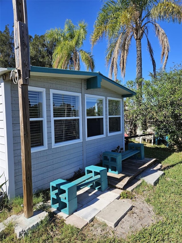 view of side of property featuring a patio