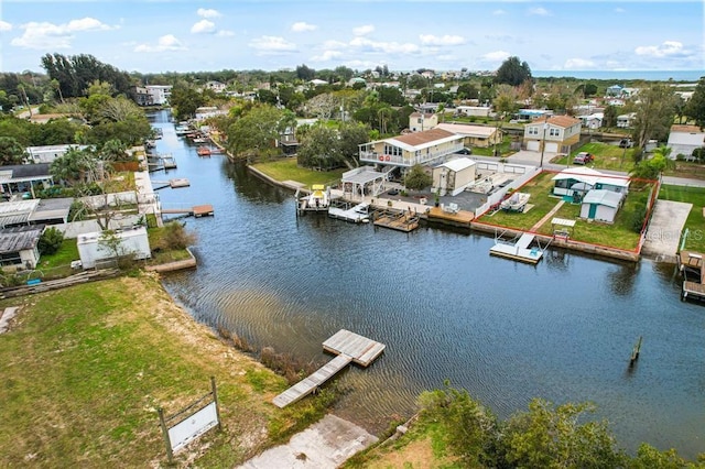 bird's eye view featuring a residential view and a water view