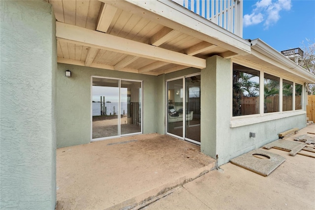 property entrance featuring a patio