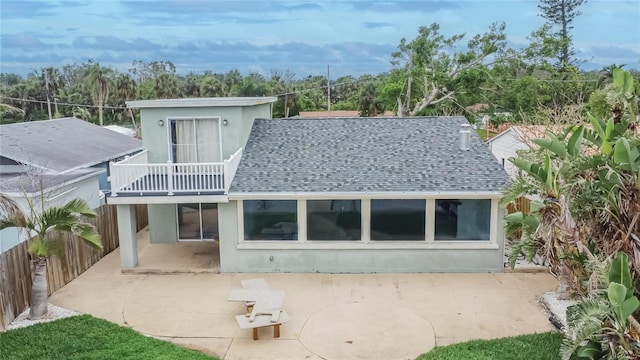 1022 Canal St, Ruskin, FL 33570 - back of house with a shingled roof, a patio area, a balcony, and stucco siding