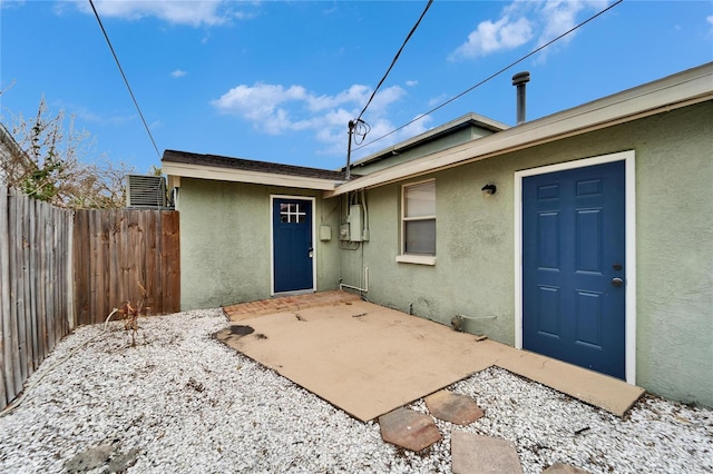 1022 Canal St, Ruskin, FL 33570 - view of exterior entry with stucco siding and a patio