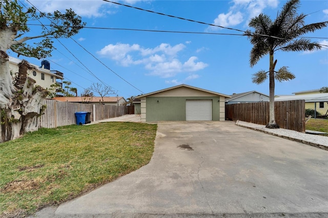 1022 Canal St, Ruskin, FL 33570 - view of side of home featuring driveway, stucco siding, and an outbuilding