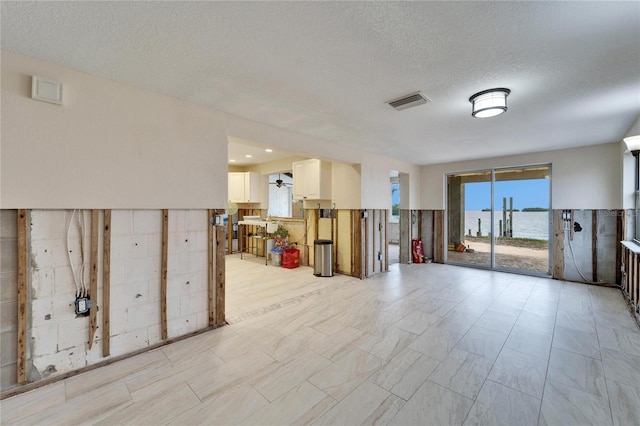 1022 Canal St, Ruskin, FL 33570 - below grade area with a textured ceiling