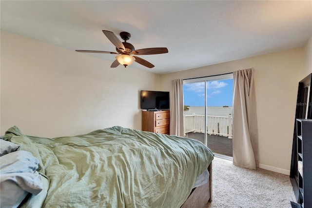 1022 Canal St, Ruskin, FL 33570 - bedroom with access to exterior, carpet, baseboards, and ceiling fan