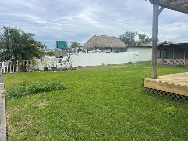 view of yard featuring a wooden deck