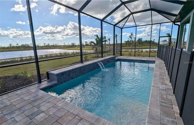 view of swimming pool featuring pool water feature, a water view, and glass enclosure