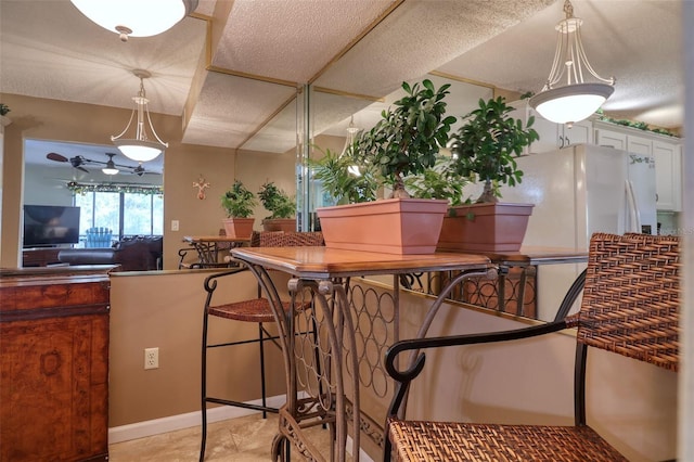 dining room featuring ceiling fan