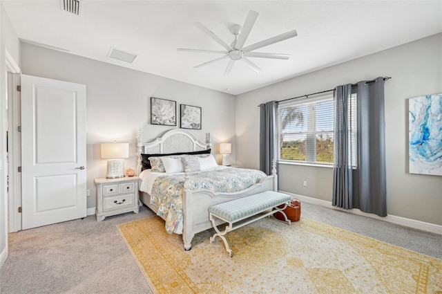 bedroom featuring light colored carpet and ceiling fan