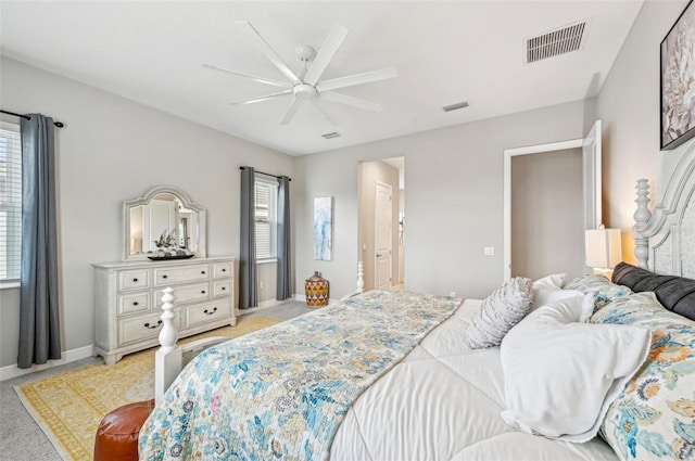 bedroom with light carpet and ceiling fan