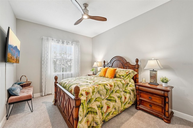 bedroom featuring light carpet and ceiling fan