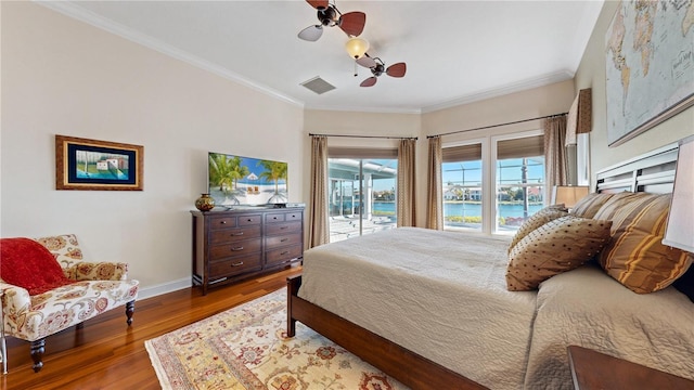 bedroom featuring access to outside, ceiling fan, crown molding, and hardwood / wood-style flooring