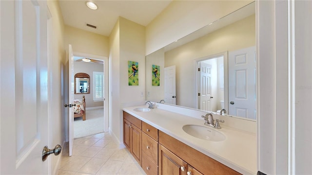 bathroom with tile patterned floors and vanity