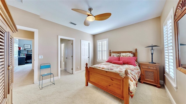 carpeted bedroom with ceiling fan