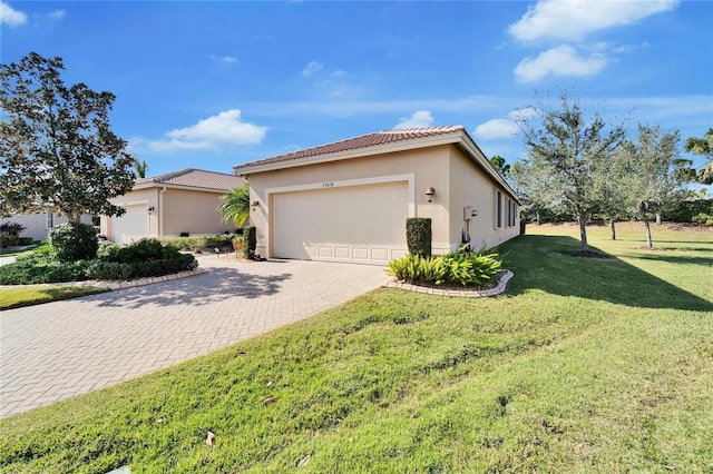 view of side of home with a yard and a garage