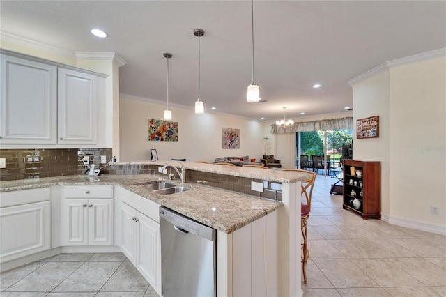 kitchen with kitchen peninsula, decorative light fixtures, dishwasher, white cabinets, and sink