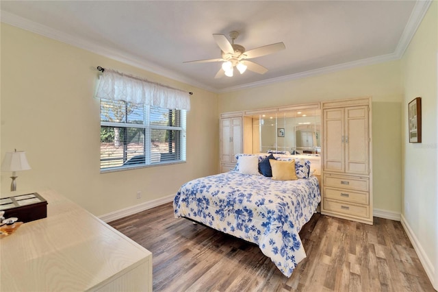 bedroom with ceiling fan, ornamental molding, and wood-type flooring