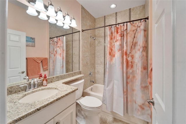 full bathroom featuring toilet, shower / bath combination with curtain, tile patterned floors, and vanity