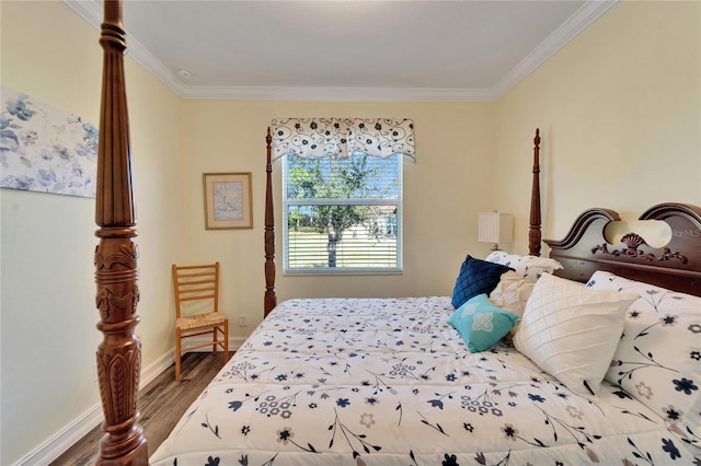 bedroom with wood-type flooring and crown molding