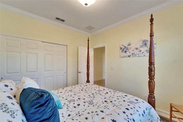 bedroom featuring a closet and crown molding