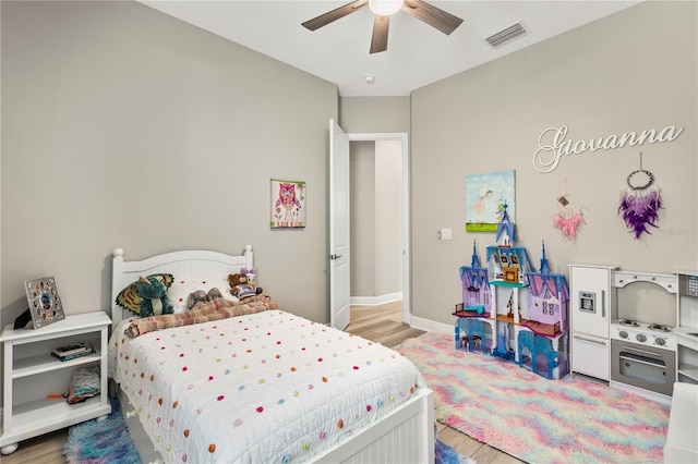 bedroom featuring ceiling fan and light hardwood / wood-style flooring