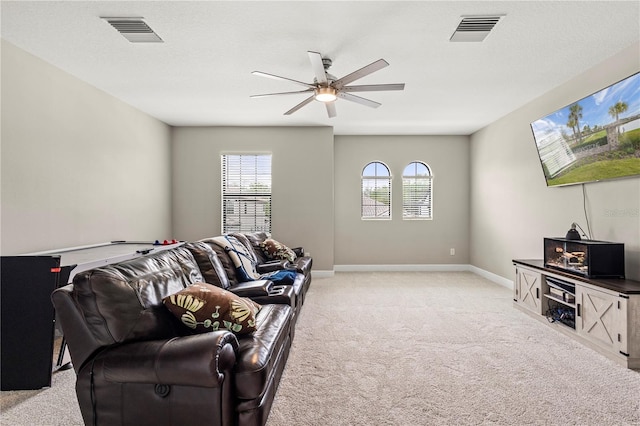 living room with ceiling fan and light carpet