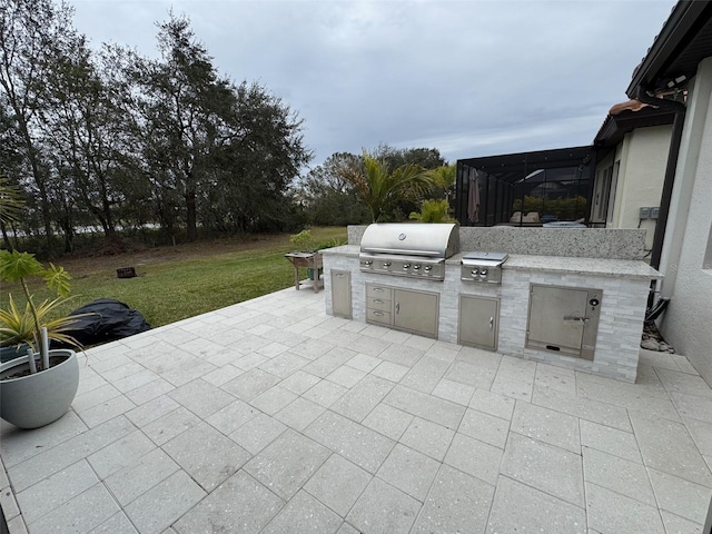 view of patio featuring area for grilling and exterior kitchen