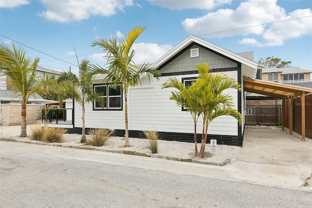 view of home's exterior with a carport