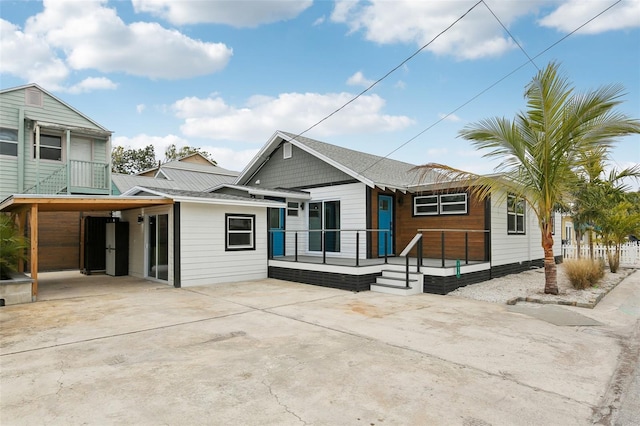 rear view of house with a carport