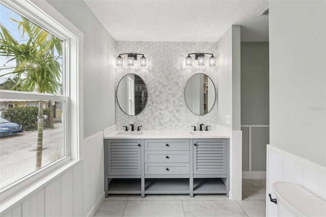 bathroom with tile patterned flooring and vanity