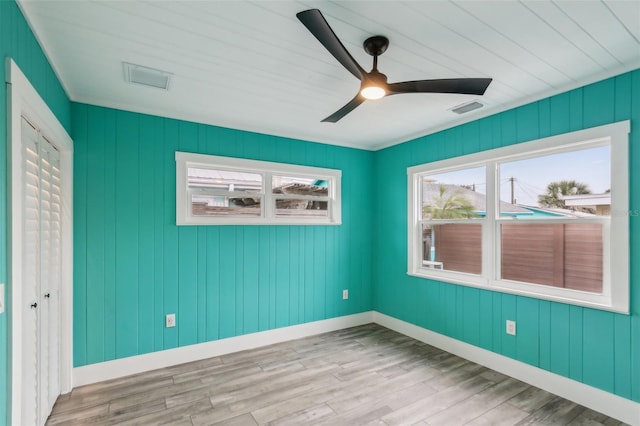 spare room featuring ceiling fan and light hardwood / wood-style floors