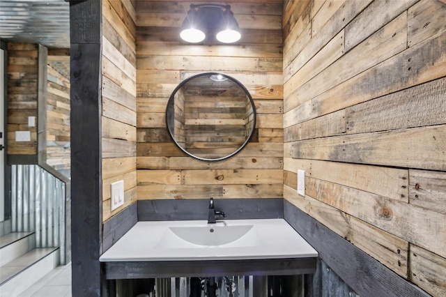 bathroom featuring wood walls