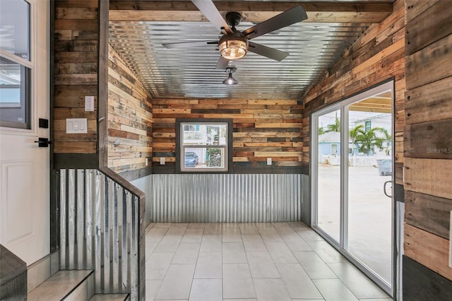 interior space with vaulted ceiling and ceiling fan