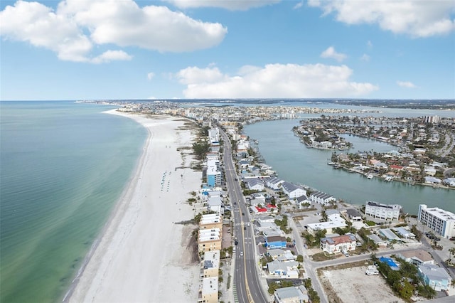 bird's eye view with a water view and a beach view