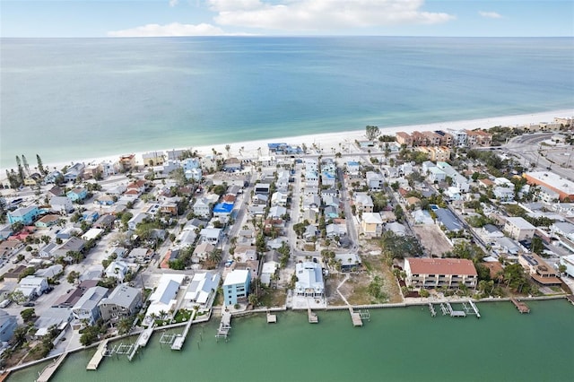 bird's eye view featuring a beach view and a water view