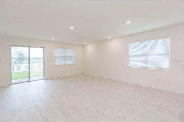 spare room featuring light hardwood / wood-style flooring