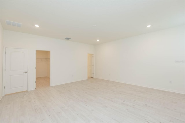 unfurnished room featuring light wood-type flooring