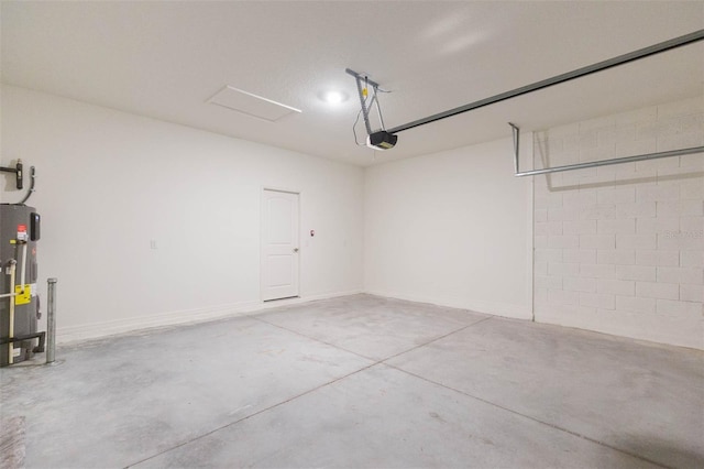 garage with a garage door opener and water heater