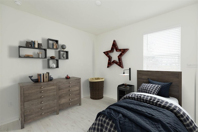 bedroom with light hardwood / wood-style flooring