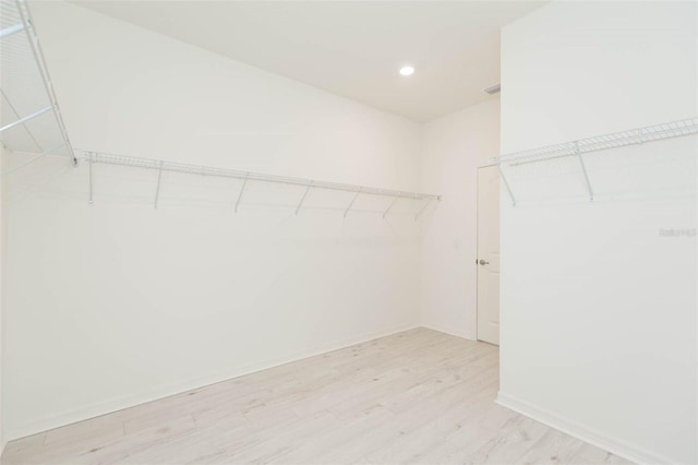 walk in closet featuring light wood-type flooring